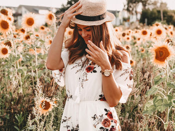 Woman wearing hat on field