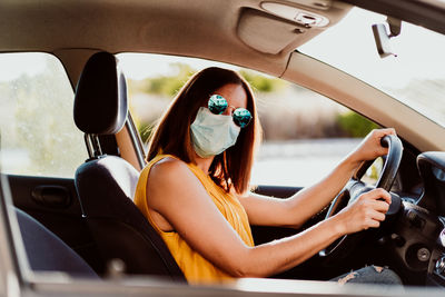 Portrait of woman sitting in car