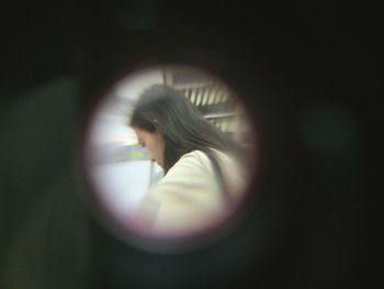 Close-up of young woman with reflection