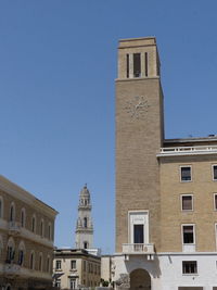 Low angle view of building against clear blue sky