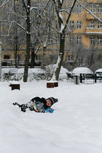 Rear view of person walking in snow