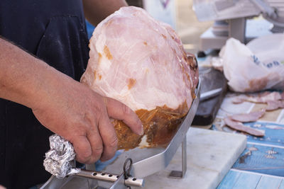 Midsection of man holding food