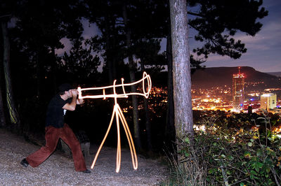 Man on swing at night