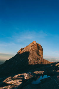 Rock formations against blue sky