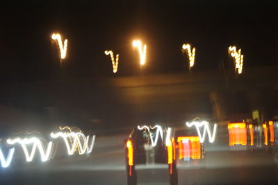 Illuminated light painting on road at night