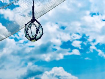 Low angle view of decoration hanging against sky
