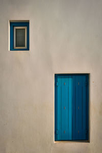 Closed blue door of building