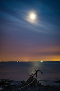 Scenic view of sea against sky at sunset