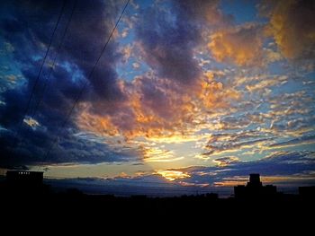 Scenic view of landscape against cloudy sky