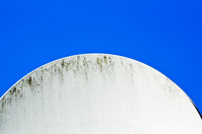 Low angle view of built structure against clear blue sky