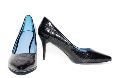Close-up of shoes against white background