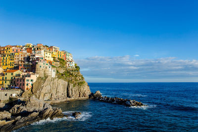 Scenic view of cinque terre against sky