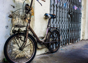 Bicycle parked on wall