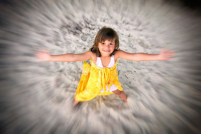 Portrait of cute girl playing in water