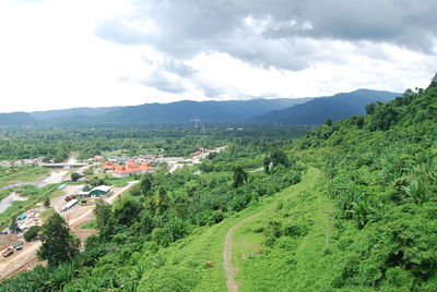 Scenic view of landscape and mountains against sky