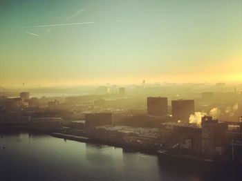 Cityscape against sky during sunset