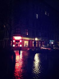 Reflection of illuminated buildings in water