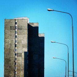 Low angle view of building against clear blue sky