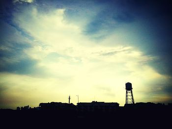 Low angle view of built structure against sky at sunset