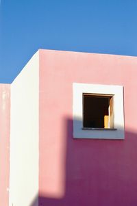 White building against blue sky