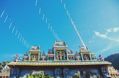 Low angle view of temple against sky at batu caves