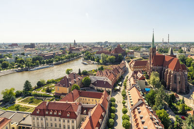 Poland, lower silesian voivodeship, wroclaw, aerial view of oder river and surrounding old town buildings in summer