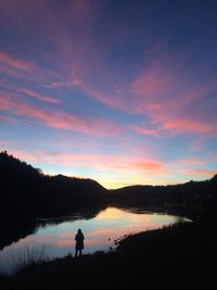 Silhouette of lake at sunset