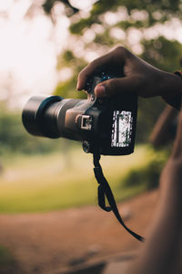 Close-up of hand holding camera