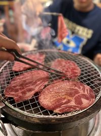 Close-up of meat on barbecue grill