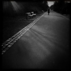 Woman walking on road