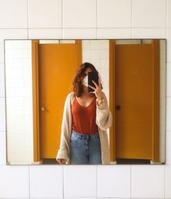 Young woman reflected on a mirror