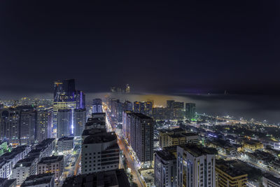 Illuminated buildings in city at night