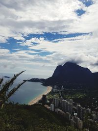 High angle view of bay and buildings against sky