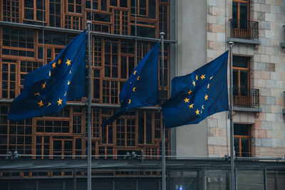 Low angle view of european flags in front of european parliement