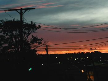 Low angle view of silhouette trees against sky during sunset