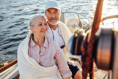 Portrait of smiling young couple in sea