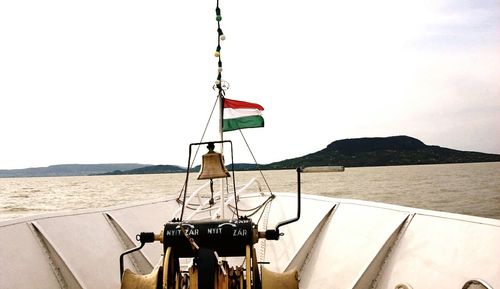 Calm sea with mountain range in background