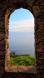 Scenic view of sea seen through window