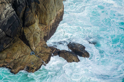 High angle view of waving on the sea