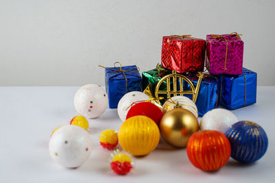 Close-up of multi colored umbrellas on table