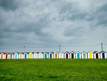 Beach huts in  row on the green