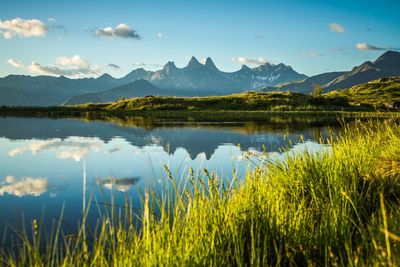 Scenic view of lake against sky. the aiguilles d arves  from lake guichard