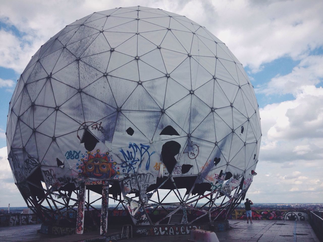 sky, cloud - sky, built structure, architecture, dome, building exterior, arts culture and entertainment, cloudy, low angle view, travel, cloud, ferris wheel, travel destinations, amusement park, tourism, amusement park ride, famous place, day, outdoors, incidental people