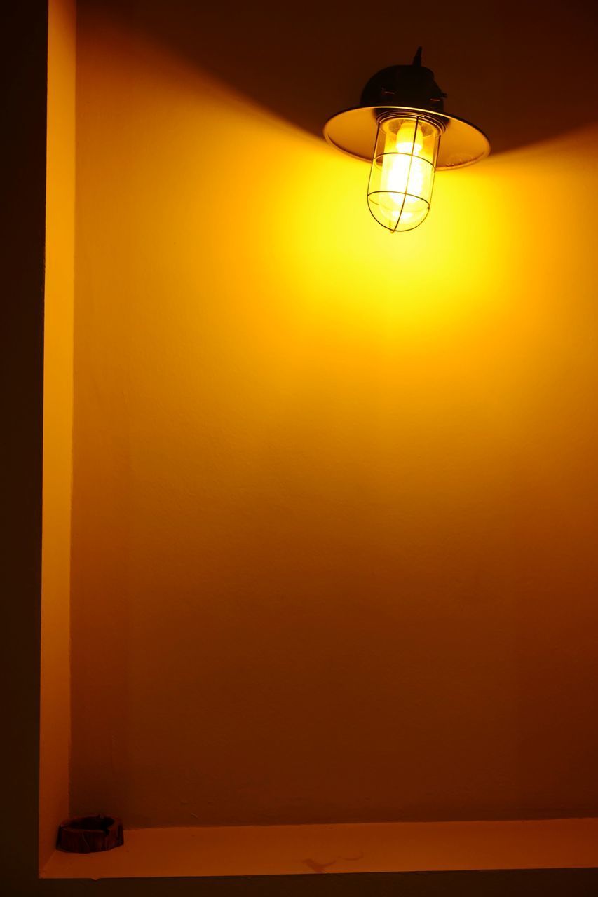 LOW ANGLE VIEW OF LIGHT BULB HANGING ON CEILING