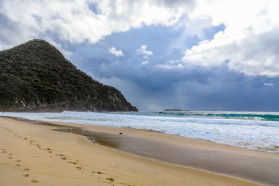 Scenic view of beach against sky