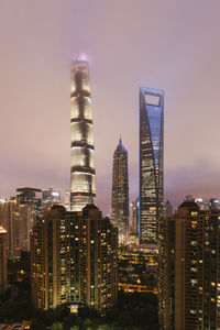 Shanghai world financial center with modern buildings at night, china