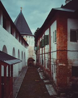 Footpath amidst buildings in town