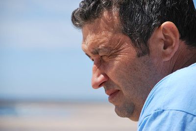 Portrait of man looking at sea