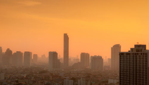 Air pollution in bangkok, thailand. smog and fine dust of pm2.5 covered city in the morning.