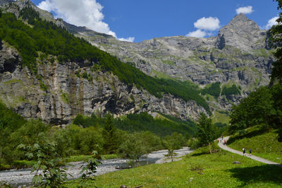 Scenic view of landscape and mountains against sky